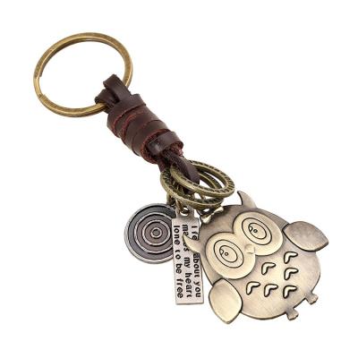 China Retro Woven Key Chain Personal Popular Adornmen Accessories Bronze Owl Soft Leather Bag Pendant for sale