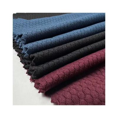 China Memory Honeycomb Pattern Jacquard Fabric 100% Polyester Knitted Jacquard Fabric 145GSM For T-shirts And Sportswear for sale