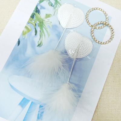 China Reusable Premium Heart Shape Adhesive Fur Nipple Covers Tassels White Feather Glitter Reusable Nipple Pies for sale