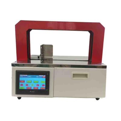 China Food Tying New Automatic Kraft Paper Hot Melt Paper Tape Package Tying Machine for sale