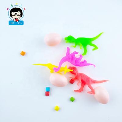 China Cartoon Toys Mini Plastic Dinosaur Toys Dragon Eggs Shape Toy Multi Tattoo And Flavor Fruity Pressed Candy for sale