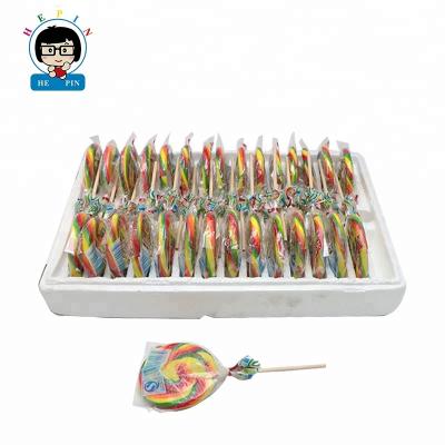 China Wholesale 50G Natural Soft Rainbow Colorful Round Flat Fruit Flavor Hard Swirl Lollipop for sale