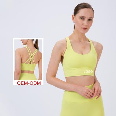 China Wholesale Breathable Sexy Chest Women Sports Yoga Bra Fitness Splicing Lift Up Cross Back Strappy Sports Yoga Bra for sale