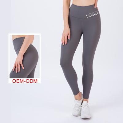 China Breathable High Waist Ladies Gym Sports Yoga Pants Gaiters With Butt Lift Nylon Gaiters Casual Pocket Workout Compression Yoga Pants for sale