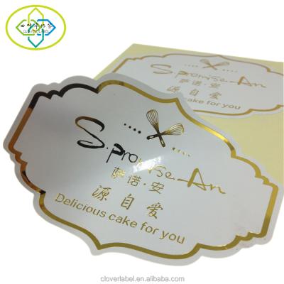 China Waterproof Custom Die Cut Transparent Vinyl Sticker Gold Foil Label Printing for sale