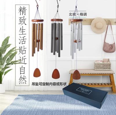 China Hollow Black Home Decoration Wind Chime Aluminum Europe Music Creative Gift European-American Border Ornaments for sale