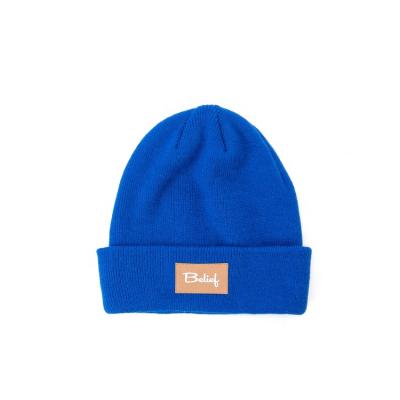 China COMMON Winter Acrylic Knitted Beanie With Leather Label Warm Outdoor Tank Top for sale