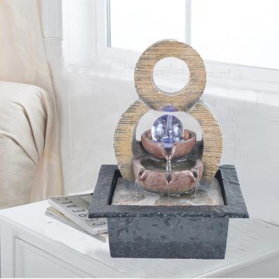 China Small Feng Shui Laminar Flow Table Top Decor Water Fountain Table Top Decor Modern Electric Waterfall Home Indoor Resin for sale