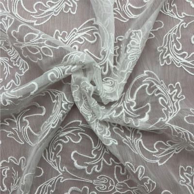 China New Style Anti Static Knit Stock Embroidery Chiffon Lace Fabric Indonesia For Dress for sale