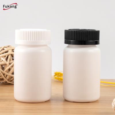 China 100ml Medicine White PE Pills Plastic Medicine Bottle, Plastic Capsule Jars With Flip Cap for sale