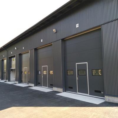 China Industrial Safety Motorized Color Steel Industrial Sectional Garage Door for sale