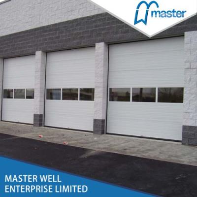 China Sectional Industrial Sound Insulation Garage Door With Pedestrian Door for sale