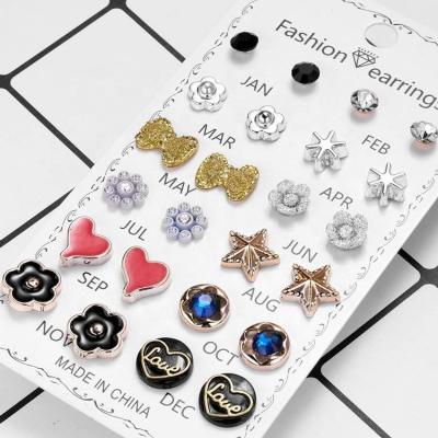 China New jewelry fashion JAN. FASHIONABLE DEC 12 Gold Ball Crystal Flower Pearl Star Heart Butterfly Stud Earring Set For Women for sale