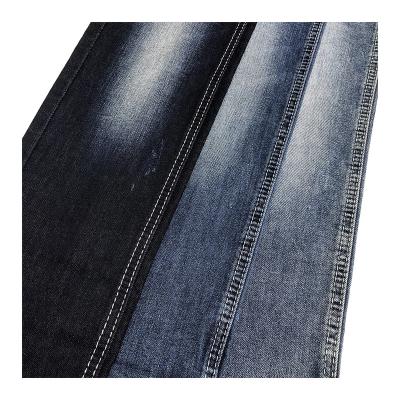 China Shrink-Resistant High Quality 9Oz Indigo With Color Background Mid Stretch Light Wash Stretch Spandex Twill Denim Stock Lot Fabric for sale