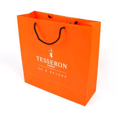 China New Materials Golden Foiled Stamping Logo Hot Recycled Shopping Gift Paper Bag With Handle for sale