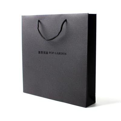 China Recycled Materials Wholesale Customize Logo Black Paper Bag With Black Rope Handle for sale