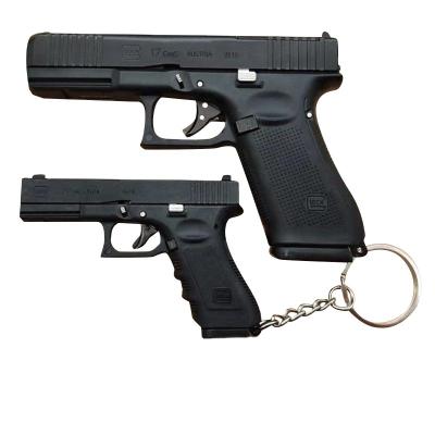 China 2023 Promotion Gift TS Wholesale Price Toy Metal Mini Gun Model Glock 1:3 Mini 70mm Glock Toy Gun Key Chain With Ejectable for sale