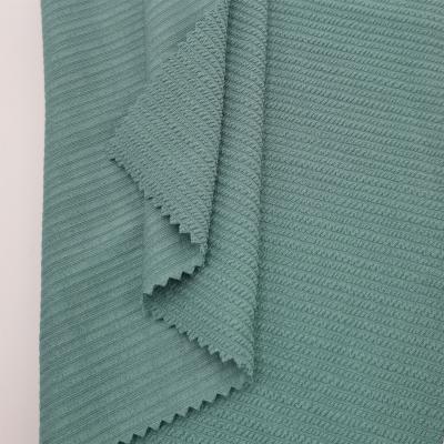 China Stretch High Quality Rich Texture Jacquard Wicking Polyester Spandex Fabric For Swimwear for sale