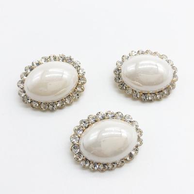 China Leg China Make Egg Button Natural Leather Shell Buttons Oval Button With Resin And Rhinestone Crystal For Women Coat Button For Sale for sale