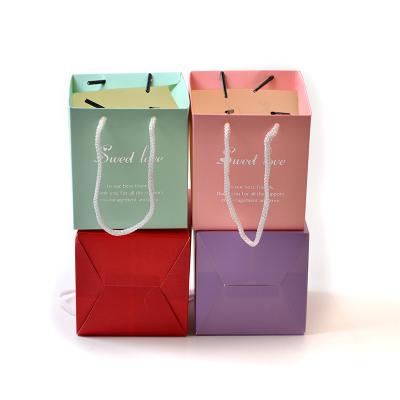 China Recyclable Portable Colored Paper Shopping Bags Gift Paper Bag Luxury Custom Logo Paper Bag Handles for sale