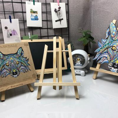 China Wooden Trapezoidal Painting Rack Advertising Display Rack Oil Painting Sketch Easel Small Easel Solid Wood Desktop Easel for sale