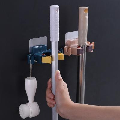 China Modern Broom Holder Wall Mounted Broom Broom Clamp Holds Self Adhesive No Belt Hook Broom & Broom Super Drill Non-Slip Clips for sale