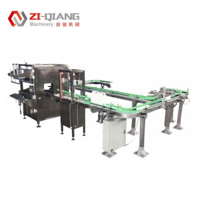 China Flexible Chain Turn Bottle Conveyor System 1 Ltr Water Bottle Packing Machine for sale