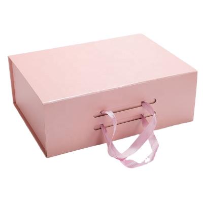 China Handmade Custom Luxury Cardboard Foldable Boxes With Ribbon Handle Clothing Shirt Packaging Gift Box for sale