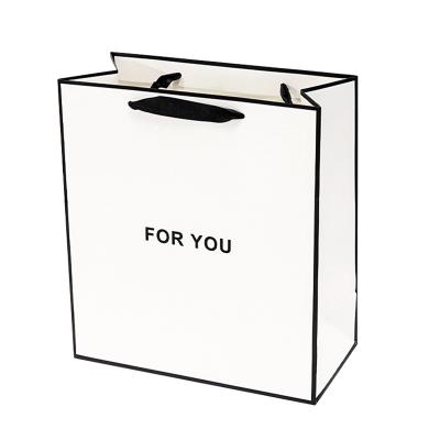 China Luxury Black Gift Paper Bag Custom Made Printed Logo Jewelry Packaging Kraft Shopping Thank You Paper Bag With Ribbon Handles en venta