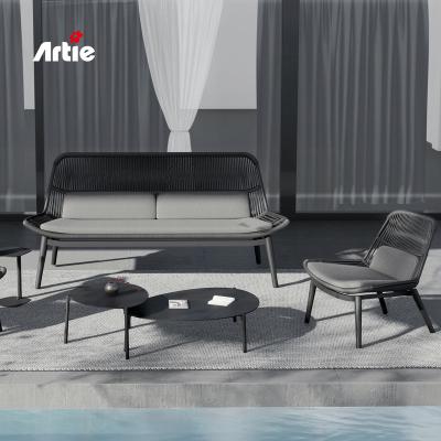 China Artie Modern Rattan Furniture Patio Double Sofa Bed Handmade Hotel Sofa Wicker UV Resistant Outdoor Garden Sofa for sale