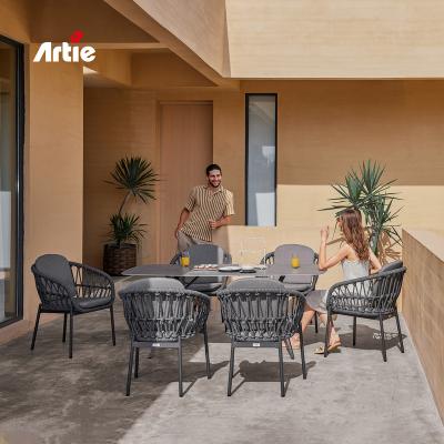 China Artie Modern Rattan Furniture Patio UV Resistant Garden Sets Rope Weaving Outdoor Tables And Chairs For Patio for sale