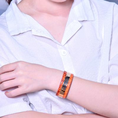 China Casual/Sporty Mens Bracelet Orange Steel And Fashion Leather Woman Soft Tactility Bracelet Lovers Gift for sale