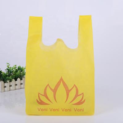 China Eco - Friendly Yellow 60gsm T Shirt Bag Eco Friendly Non Woven Shopping Bags for sale