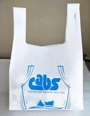 China New Eco-Friendly Wholesale Biodegradable Non Woven W-Cut T-shirt Bag Custom Shopping Tote Bags for sale