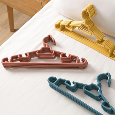 China Anti-skid Plastic Hangers, Ultra Thin Baby Clothes Hangers Space Saving Non-Slip Tubular Hangers for sale