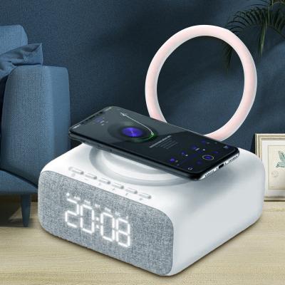 Chine Mini-ABS Portable Alarm Clock haut-parleur Lampade thérapeutique Dent bleue Chargement sans fil Fm Porteur de support de lampe de nuit à vendre