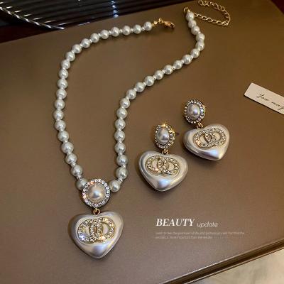 China 2022 Vintage Fashion Crystal Circle Luxury Heart Shape 925 Tremella Stud Earrings Flower Necklace Jewelry Set Luxury for sale