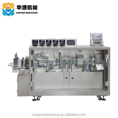 China HUAYUAN Food Flavor Rotary Liquid Small Scale Bottle Olive Oil Water Juice Automatic Digital Filling And Sealing Machine for sale