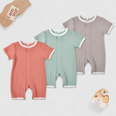 China Fashion Baby Clothes Breathable Eco - Friendly Cotton Ribbed Solid Color Baby Bodysuit Buttons for sale