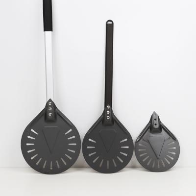 China Disposable Black Perforated Aluminum Pizza Turning Skin With Black Metal Alloy Handle For Kitchen Use for sale