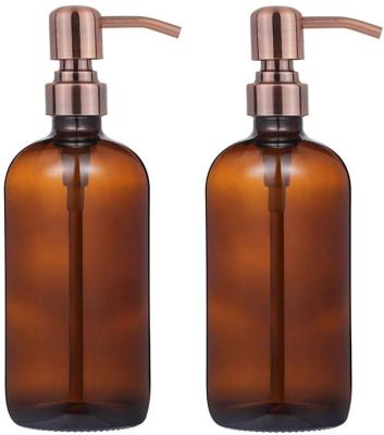 China Thick 16 Ounce Amber Glass Boston Round Bottles Chemical /Oil Brushed Stainless Steel Bronze Pumps With Rust Proof Pump for sale