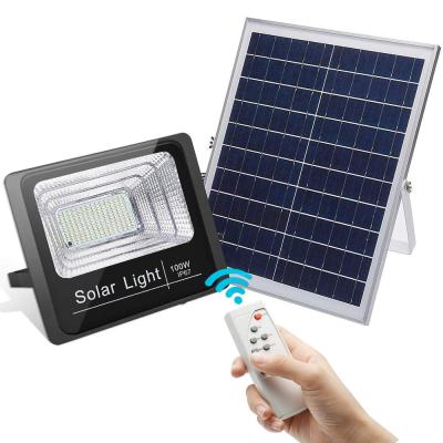 China Dusk 100W Waterproof Dawn Solar Powered Street Light IP67 Outdoor With Remote Control LED Solar Chargeable Flood Light for sale