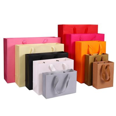 China Wholesale Recyclable Custom Luxury Kraft Paper Bag Customizable Printing Shopping Paper Bag Your Own Logo for sale