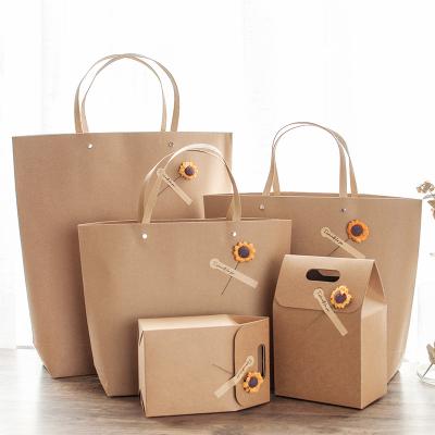 China Recyclable Customize Buying Retro Gift Bags Wholesale Twisted Brown Kraft Paper Handle Pouch Bag With Sunflower Paper Stickers And Flower for sale