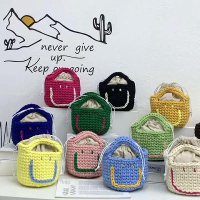 China Lady's Cute Handmade woven cotton knitted mini small woven clutch bucket bag smile handbag by miley for women lady girl for sale