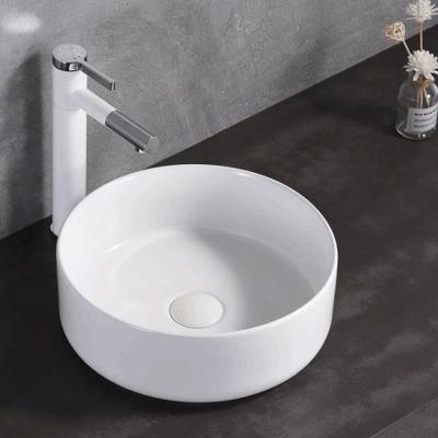 中国 Easy clean up; Soomth Modern Round White Ceramic Vessel Vanity Sink Table Top Countertop Wash Basin 販売のため