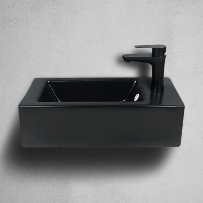 China Easy Clean Load-bearing Safety Wall Hung Sink Bathroom Sink Ceramic Black White Black Water Basin for sale