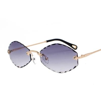 China Oval Sunglasses Fashion Small Frame Designer Eyeglasses Men Rimless Sunglasses Women Sunglasses Gradient Lenses for sale