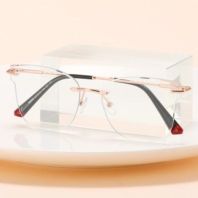 China Fashionable Wholesale Small Metal Frame New Stylish Men Custom Glasses Rimless Optical Popular Eyeglasses For Women 2023 for sale