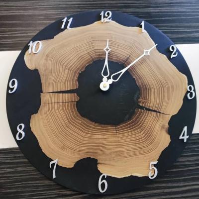 China Epoxy resin wall clock artificial wooden acacia tree wood, colorful and cool wall clock for sale